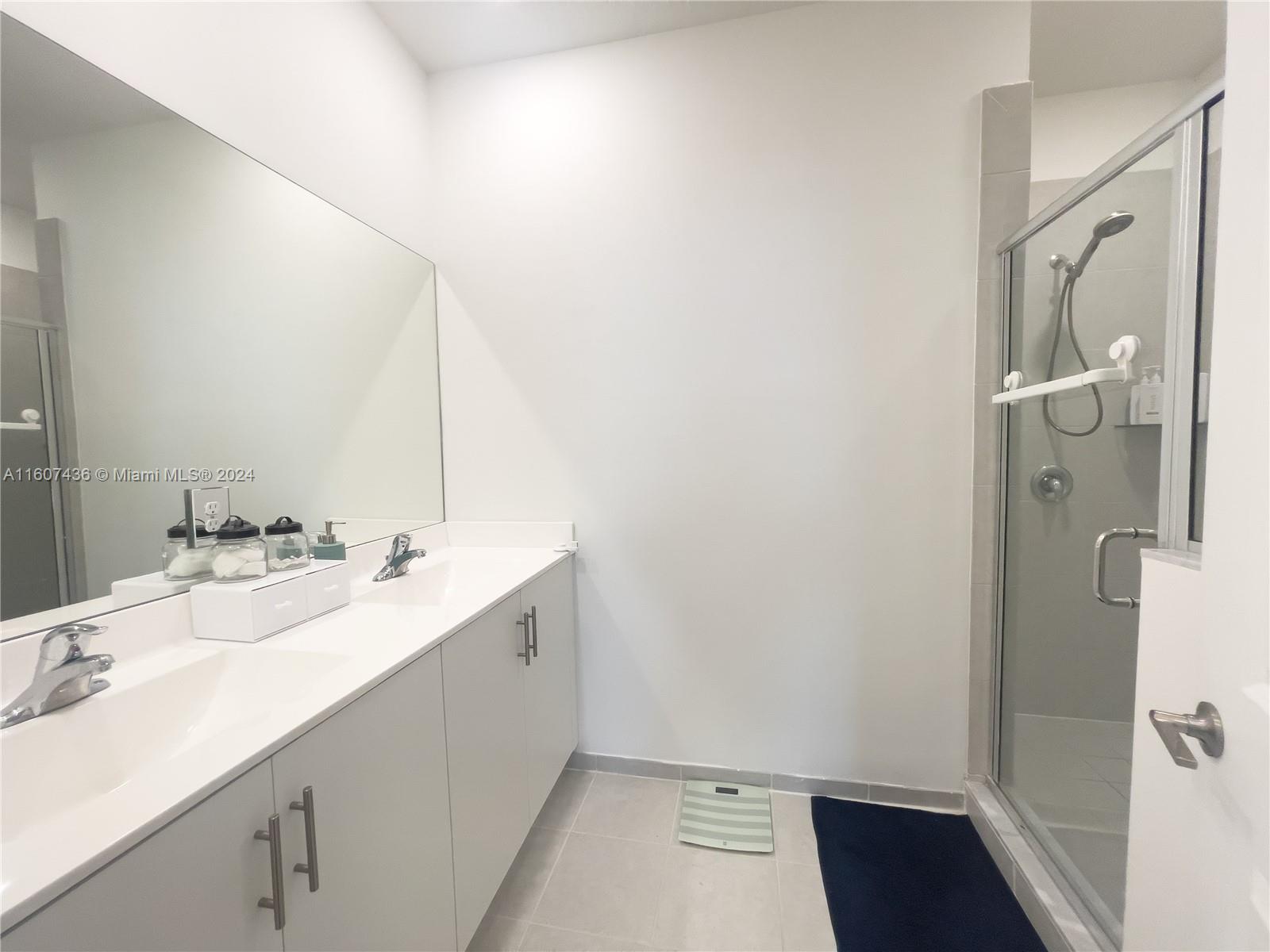 13414 Southwest 286th Street, Unit 13414 Homestead, FL 33033 - Photo 26 of 34 a bathroom with a sink and a mirror