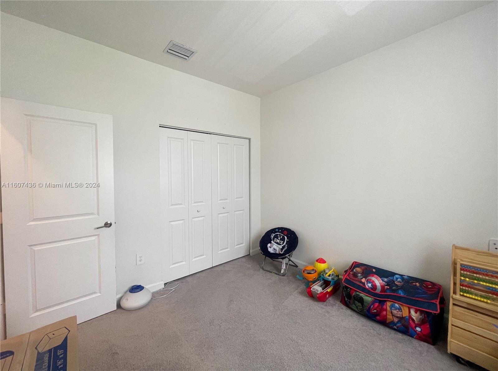 13414 Southwest 286th Street, Unit 13414 Homestead, FL 33033 - Photo 27 of 34 a view of a room with toys and a fan