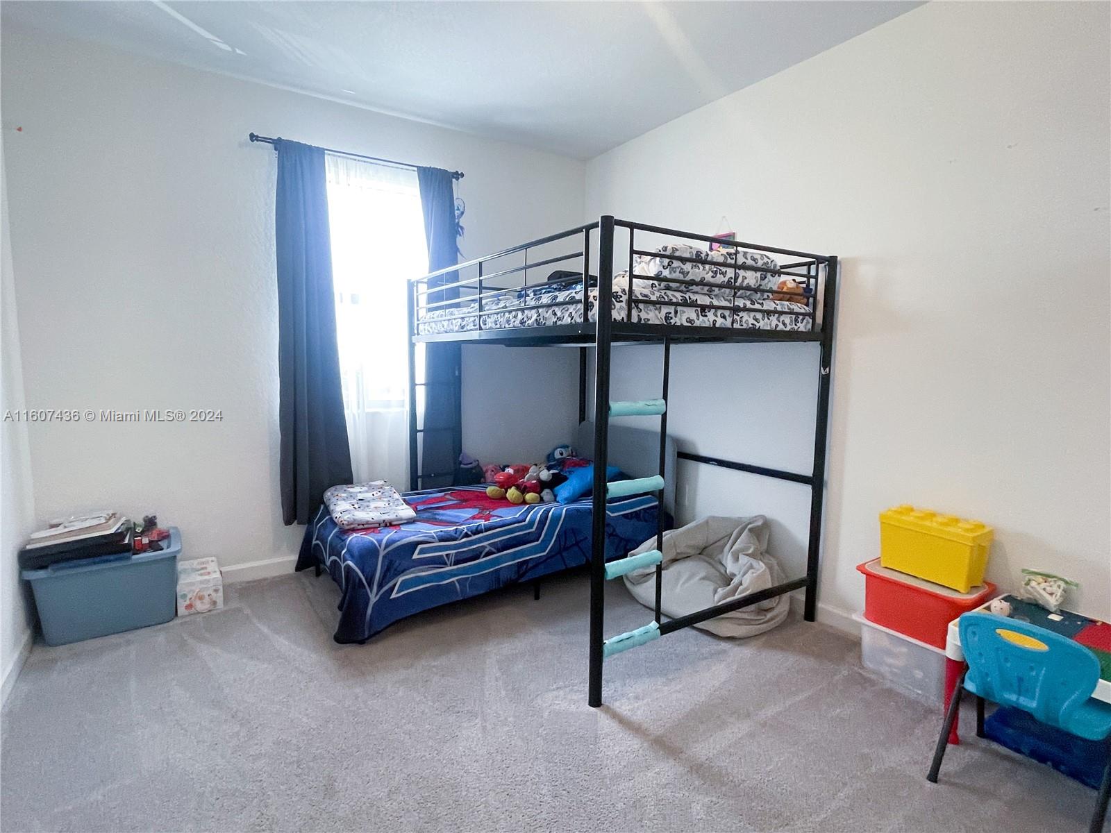 13414 Southwest 286th Street, Unit 13414 Homestead, FL 33033 - Photo 29 of 34 a living room with furniture and a chandelier