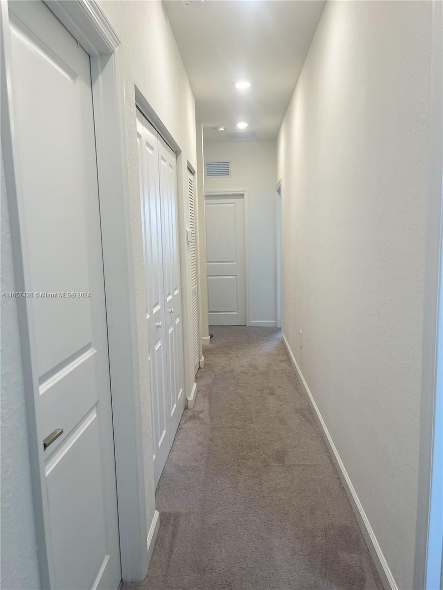 13414 Southwest 286th Street, Unit 13414 Homestead, FL 33033 - Photo 32 of 34 a view of hallway