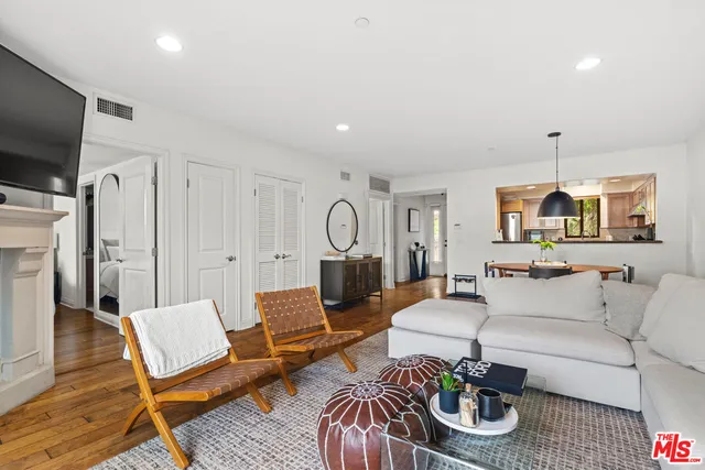 a living room with furniture fireplace and a flat screen tv