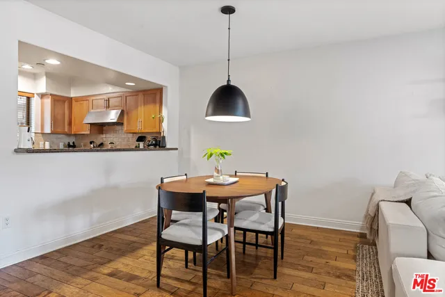 a kitchen with granite countertop stainless steel appliances and wooden cabinets