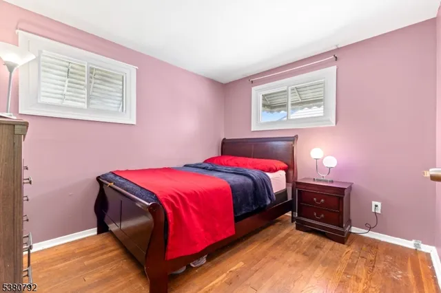 a bedroom with a bed and a lamp