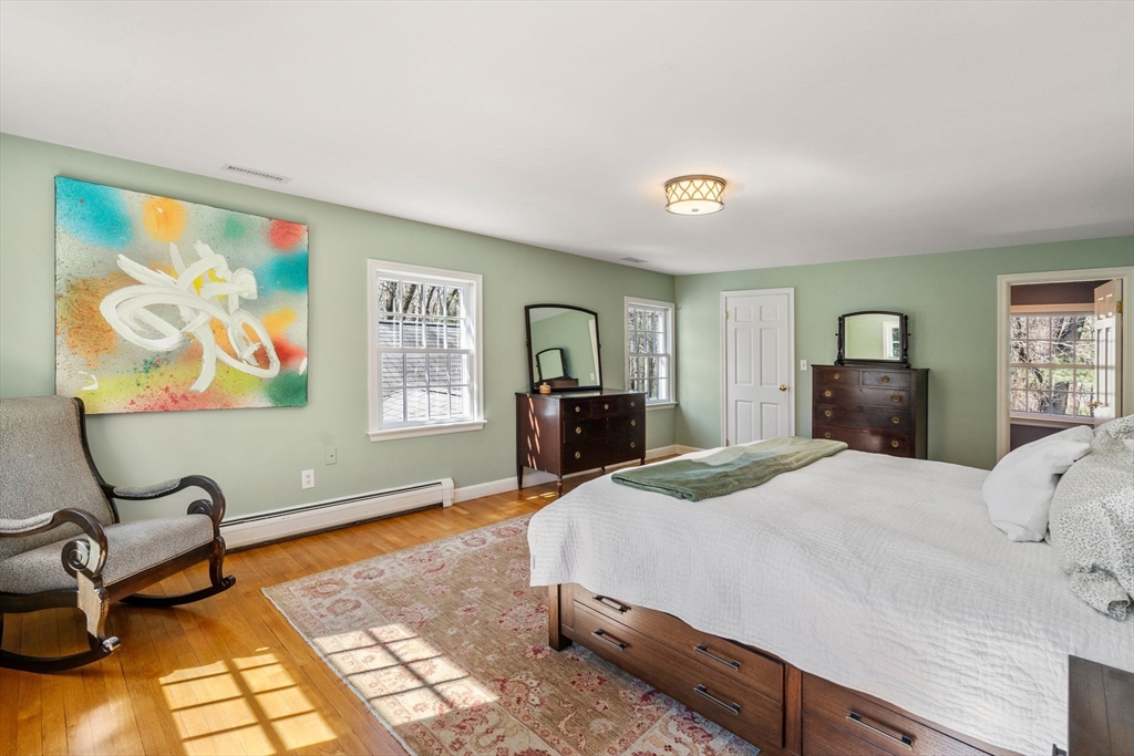 3 Goose Pond Road Lincoln, MA 01773 - Photo 27 of 37 a bedroom with a bed and dresser with mirror