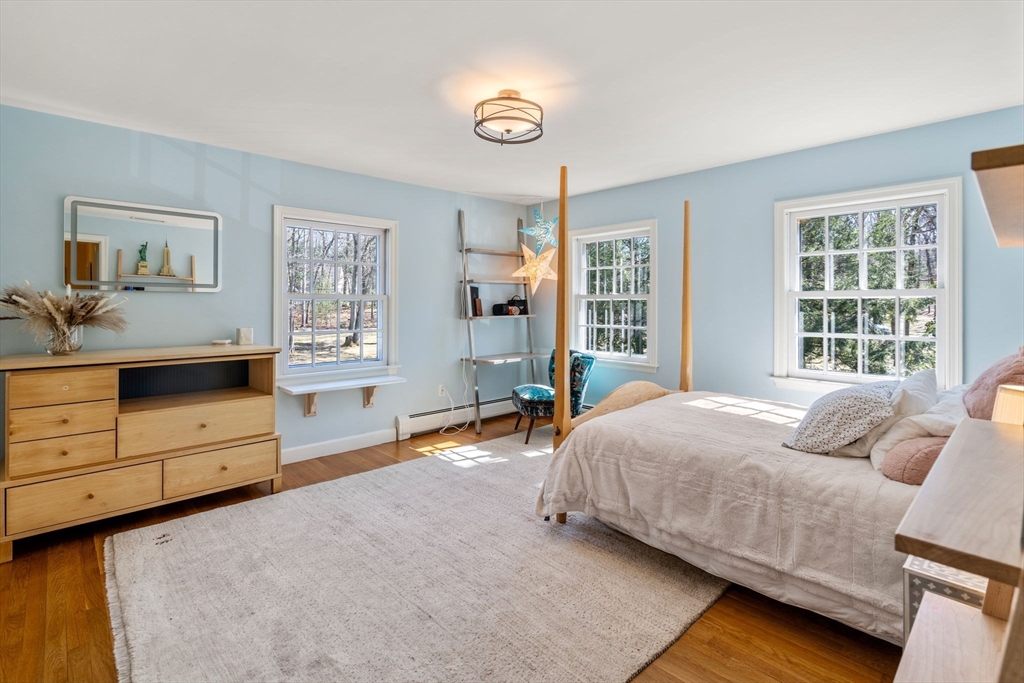 3 Goose Pond Road Lincoln, MA 01773 - Photo 29 of 37 a bedroom with a bed and a dresser