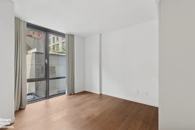 a kitchen with stainless steel appliances granite countertop a sink and a stove