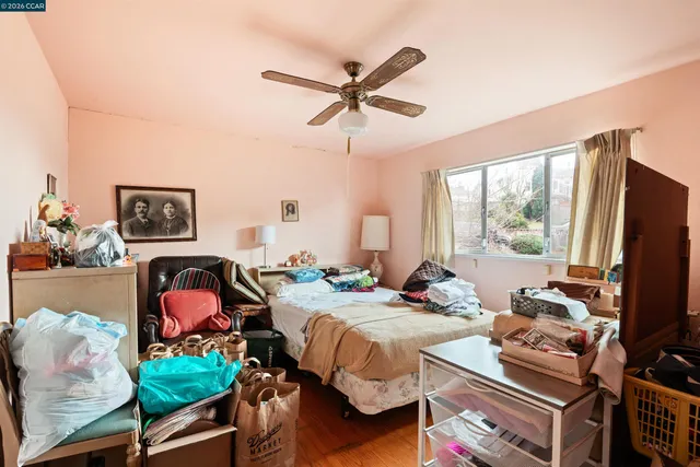 a bedroom with bed and a window