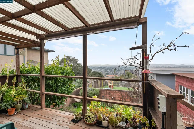 a view of a balcony with wooden floor