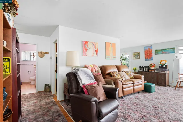 a living room with furniture and a couch