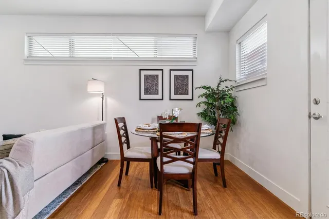 a view of a dining room with furniture and window