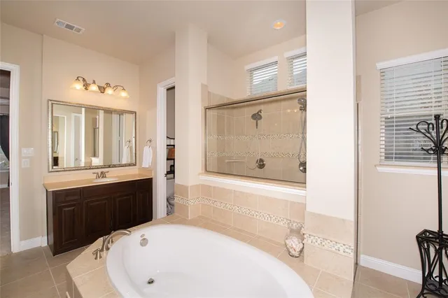 a bathroom with a bathtub and a sink