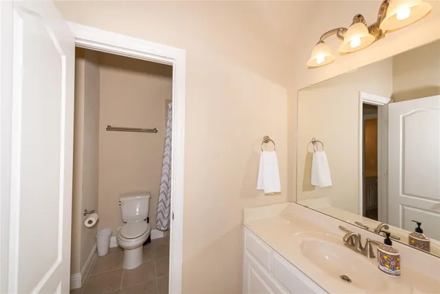 a bathroom with a sink vanity and a mirror