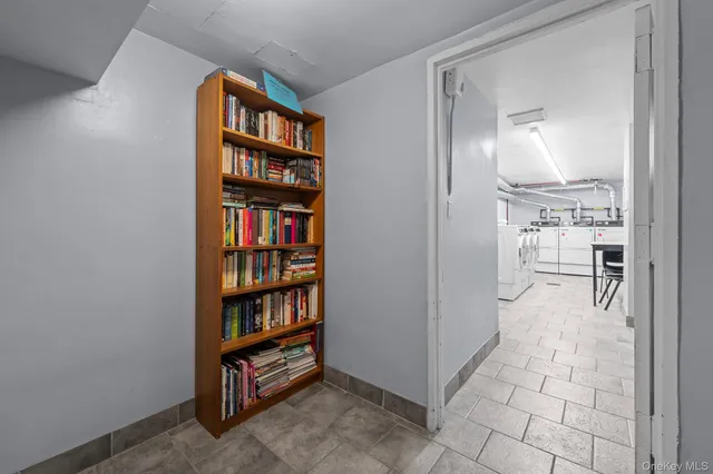 a view of a livingroom with shelves