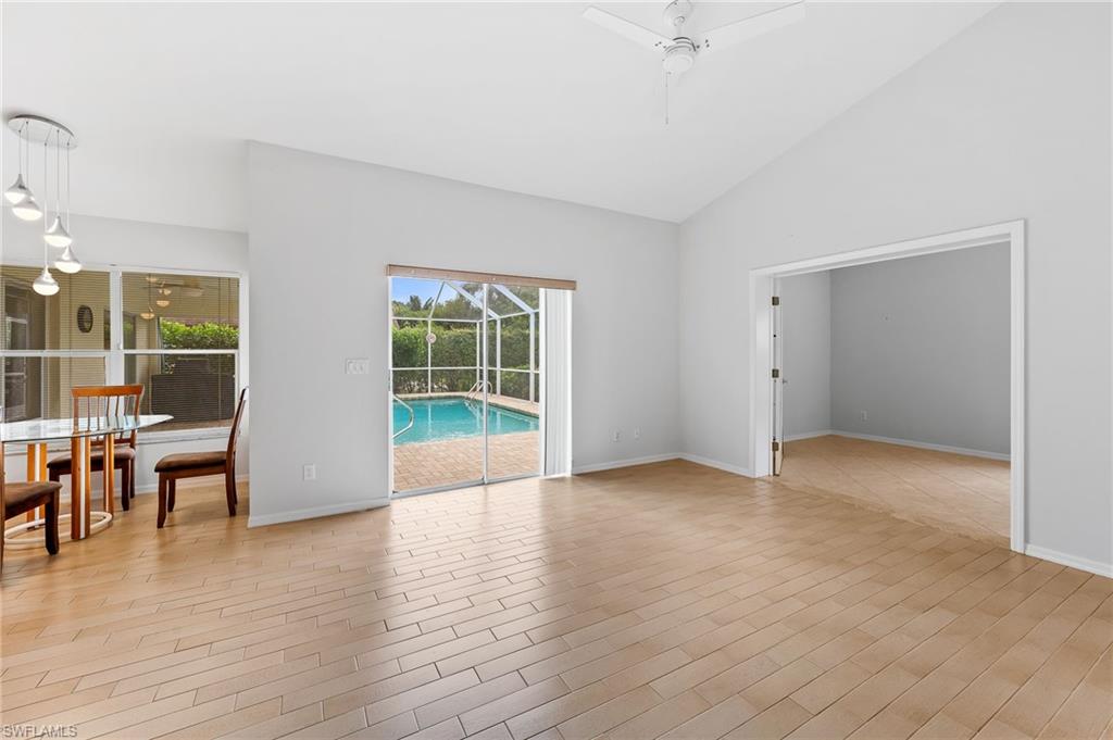 511 Ibis Way Naples, FL 34110 - Photo 14 of 46 a view of empty room with wooden floor and fan