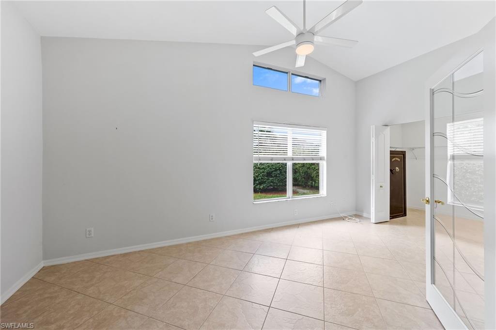 511 Ibis Way Naples, FL 34110 - Photo 17 of 46 a view of an empty room with a window