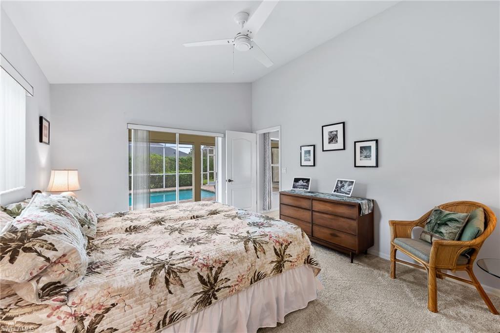 511 Ibis Way Naples, FL 34110 - Photo 20 of 46 a bedroom with a bed couch and a window