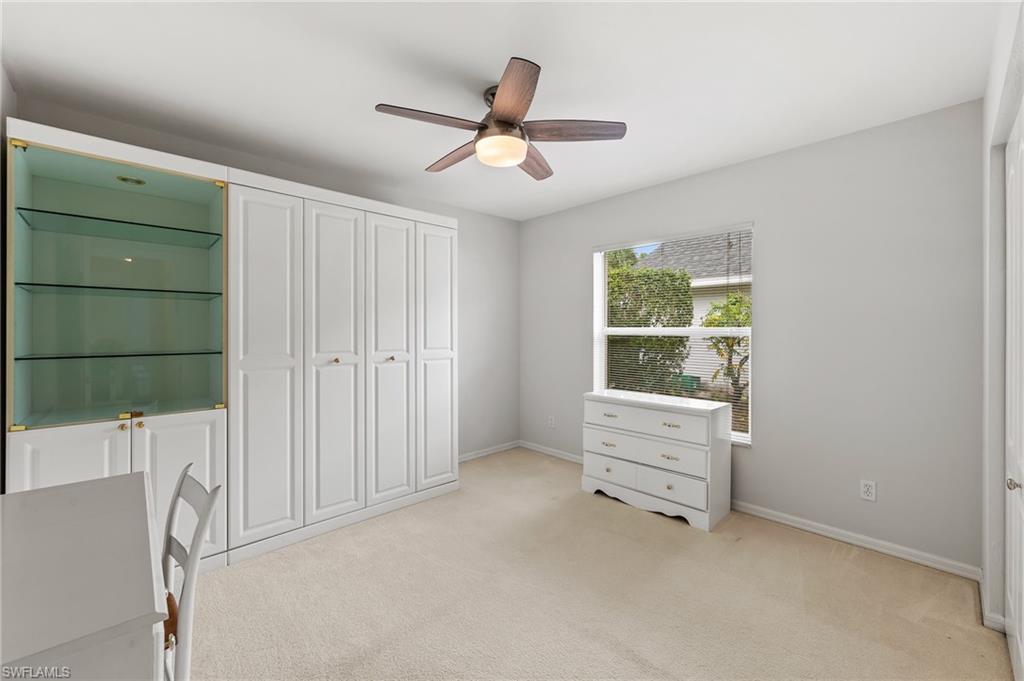 511 Ibis Way Naples, FL 34110 - Photo 26 of 46 an empty room with closet and windows