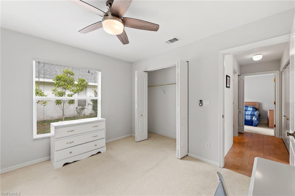 511 Ibis Way Naples, FL 34110 - Photo 27 of 46 a view of room with cabinet and ceiling fan