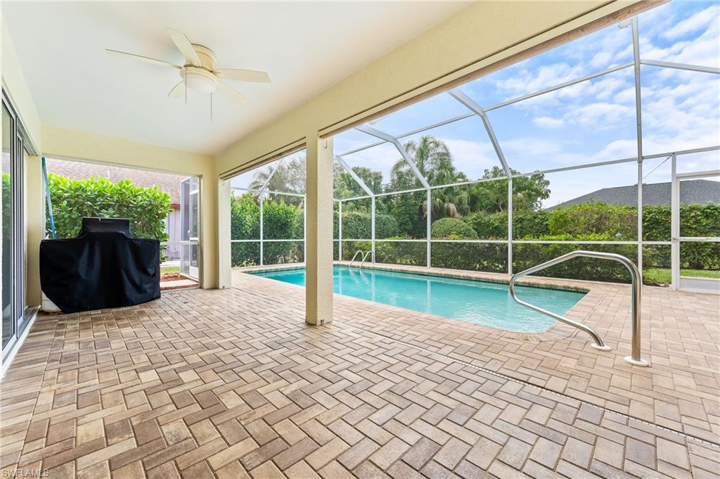 511 Ibis Way Naples, FL 34110 - Photo 32 of 46 a view of a deck with a floor to ceiling windows and wooden floor