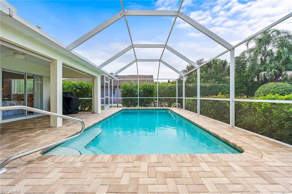 511 Ibis Way Naples, FL 34110 - Photo 33 of 46 a view of a swimming pool with a patio