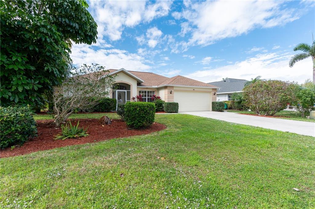 511 Ibis Way Naples, FL 34110 - Photo 37 of 46 a view of an house with backyard space and garden