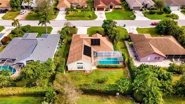 an aerial view of residential houses with outdoor space