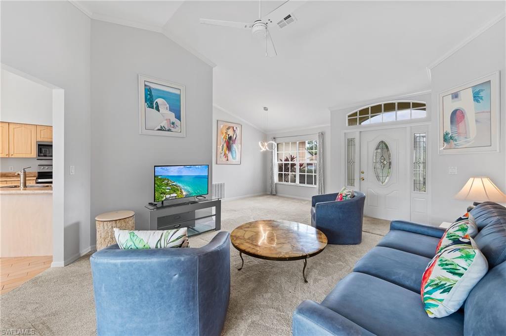 511 Ibis Way Naples, FL 34110 - Photo 5 of 46 a living room with furniture and a flat screen tv