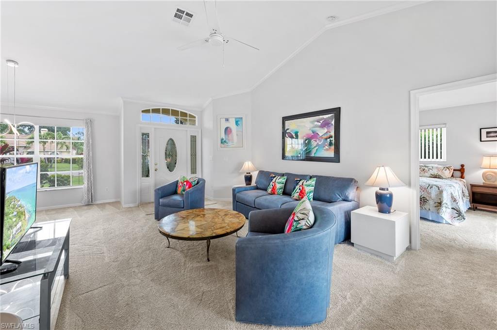 511 Ibis Way Naples, FL 34110 - Photo 6 of 46 a living room with furniture and a large window