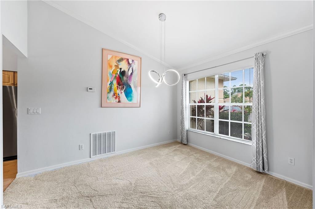511 Ibis Way Naples, FL 34110 - Photo 7 of 46 an empty room with window