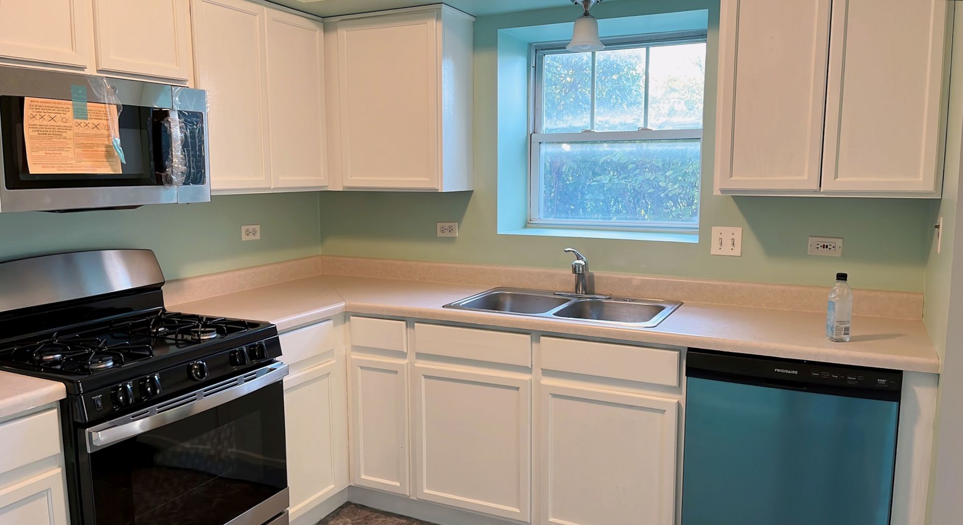 237 North Mill Road, Unit 2 Addison, IL 60101 - Photo 15 of 39 a kitchen with stainless steel appliances a sink stove and cabinets