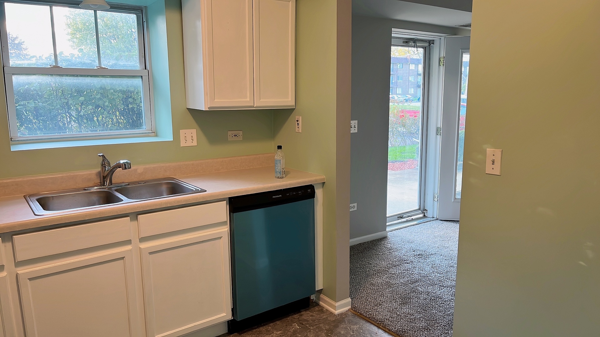 237 North Mill Road, Unit 2 Addison, IL 60101 - Photo 16 of 39 a kitchen with a sink and cabinets