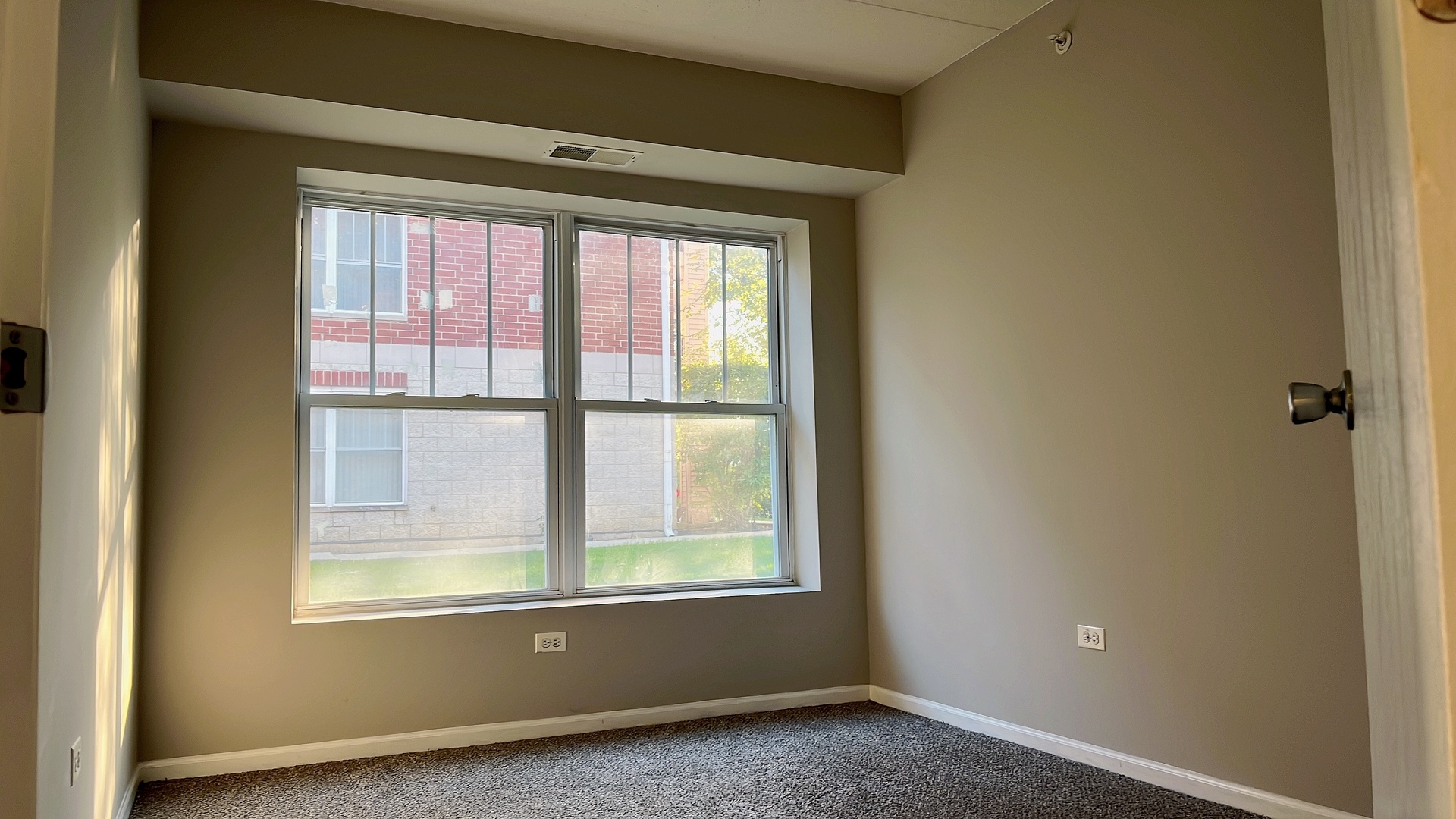 237 North Mill Road, Unit 2 Addison, IL 60101 - Photo 31 of 39 an empty room with a window