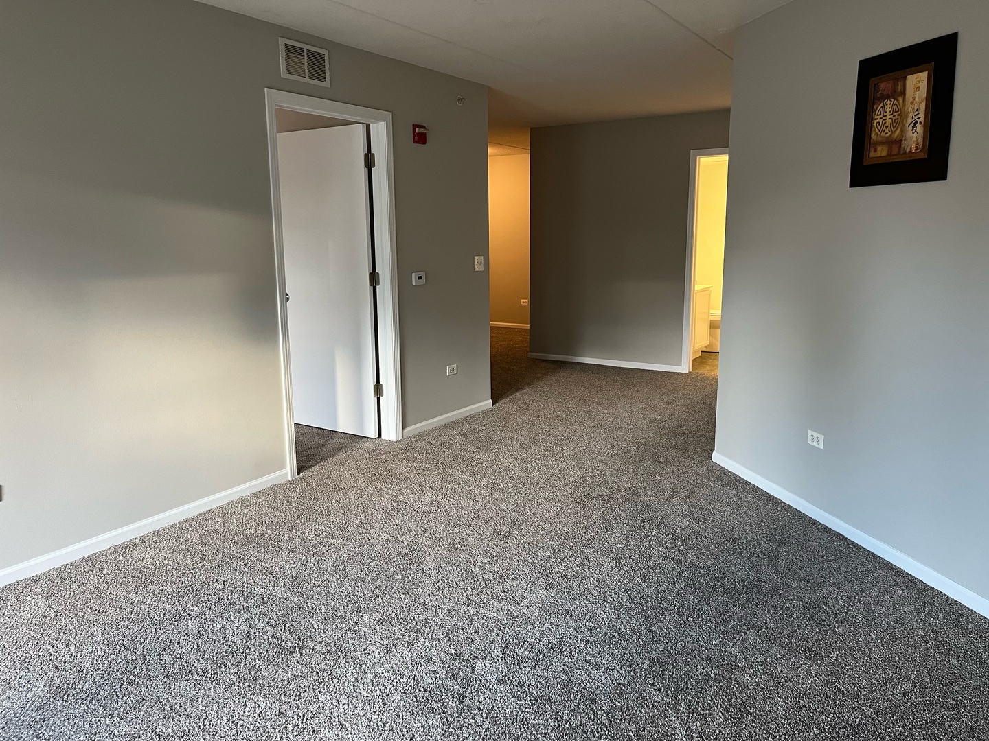 237 North Mill Road, Unit 2 Addison, IL 60101 - Photo 8 of 39 an empty room with windows and closet
