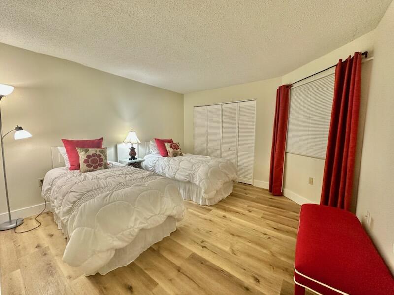 381 Santa Rosa Boulevard, Unit 709 Fort Walton Beach, FL 32548 - Photo 3 of 20 a bedroom with a bed and a flat screen tv