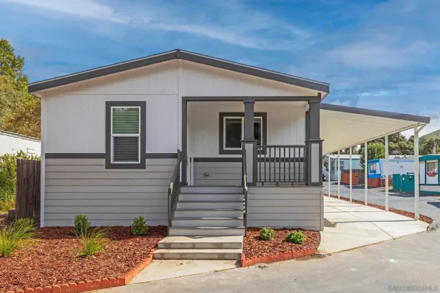 a view of a house with a small yard