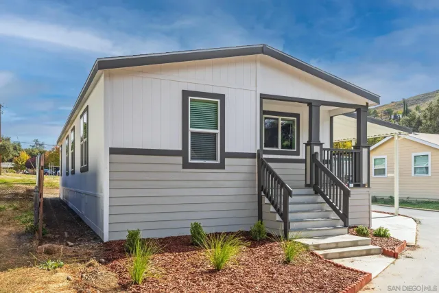 a view of a house with roof and sitting area