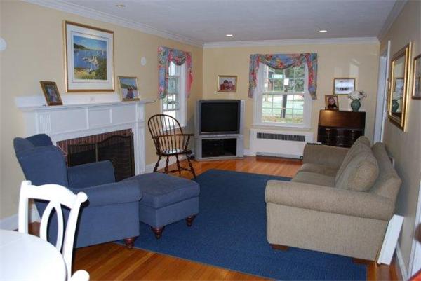 8 Thornton Road Waltham, MA 02453 - Photo 3 of 17 a living room with furniture fireplace and a flat screen tv