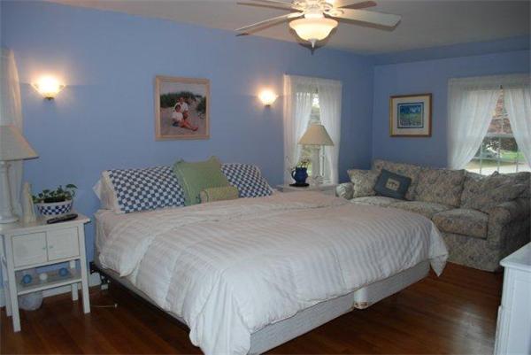 8 Thornton Road Waltham, MA 02453 - Photo 10 of 17 a bedroom with a bed and a chandelier