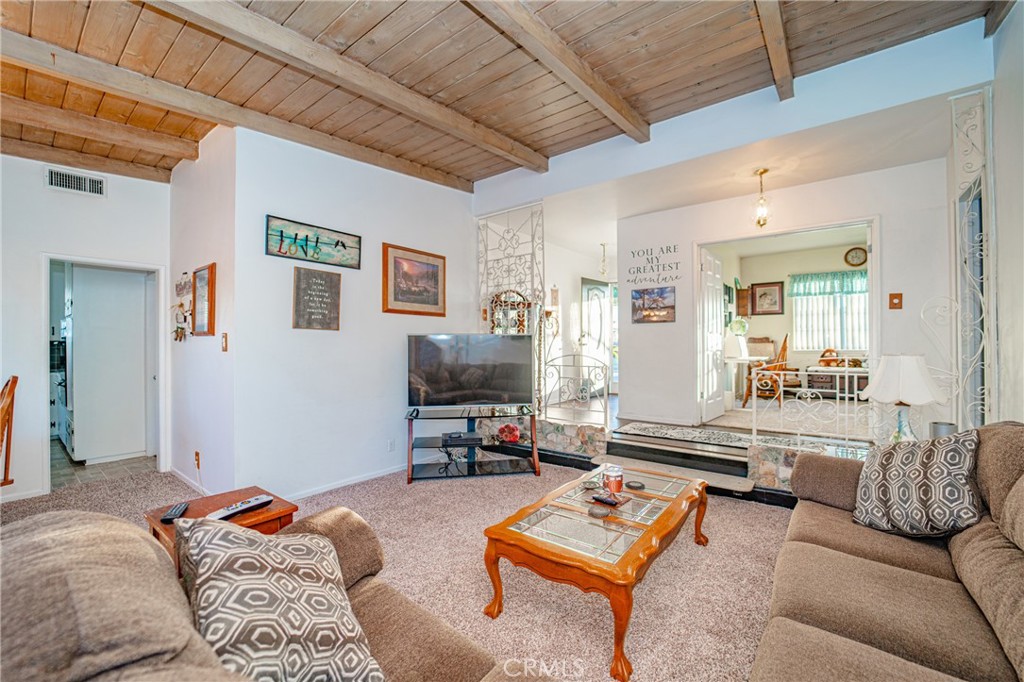 15212 Elmbrook Drive La Mirada, CA 90638 - Photo 11 of 51 a living room with furniture and a flat screen tv