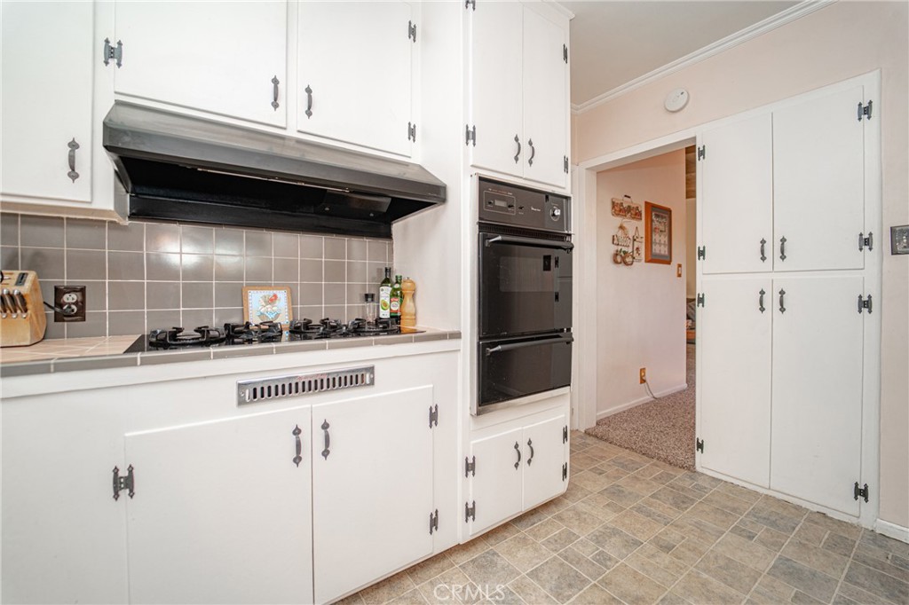 15212 Elmbrook Drive La Mirada, CA 90638 - Photo 18 of 51 a kitchen with stainless steel appliances a refrigerator and cabinets