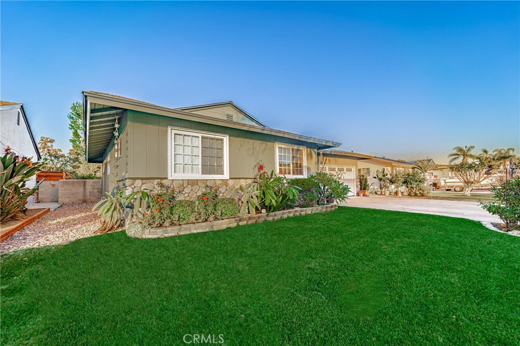 15212 Elmbrook Drive La Mirada, CA 90638 - Photo 2 of 51 a front view of a house with a yard