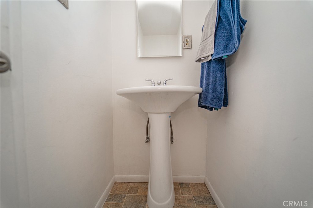 15212 Elmbrook Drive La Mirada, CA 90638 - Photo 22 of 51 a bathroom with a sink and a mirror