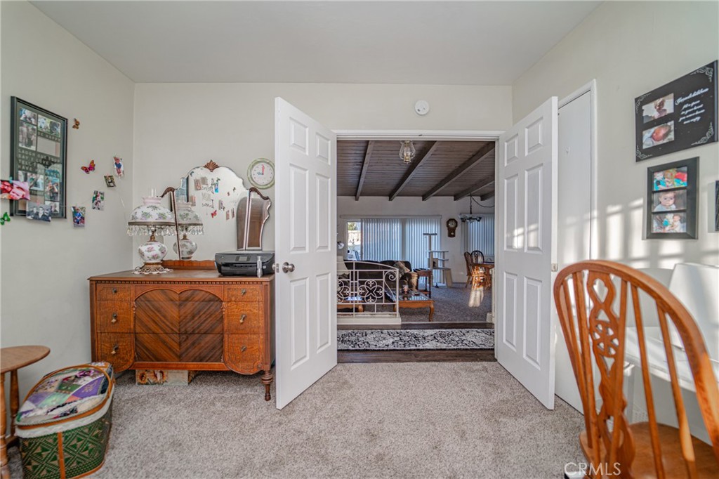 15212 Elmbrook Drive La Mirada, CA 90638 - Photo 25 of 51 a living room with furniture fireplace and a window