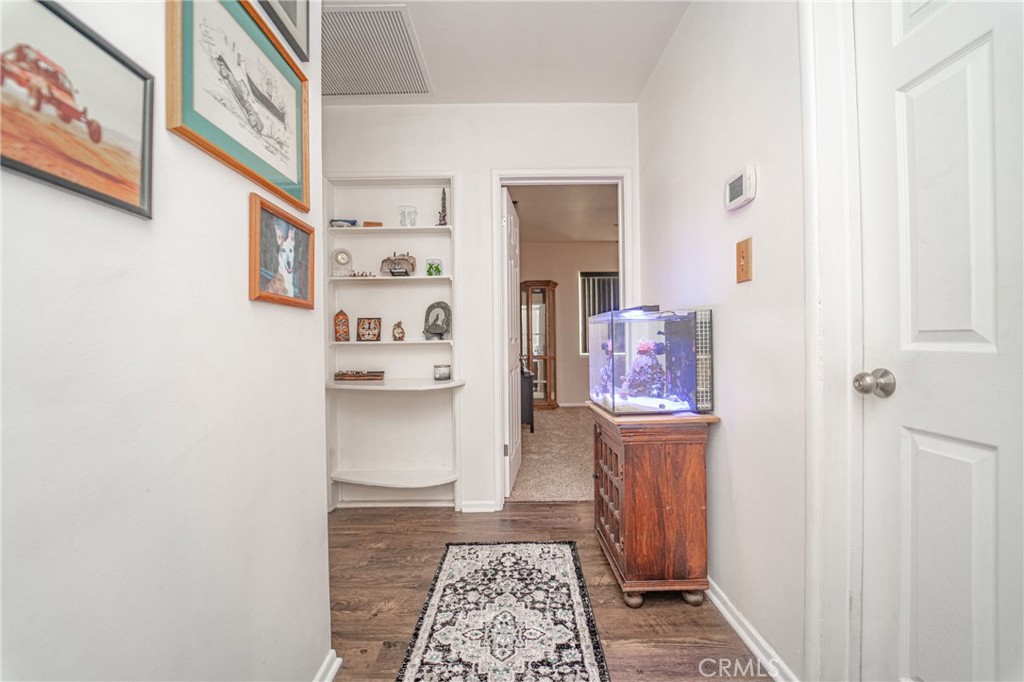 15212 Elmbrook Drive La Mirada, CA 90638 - Photo 30 of 51 a hallway with table and closet