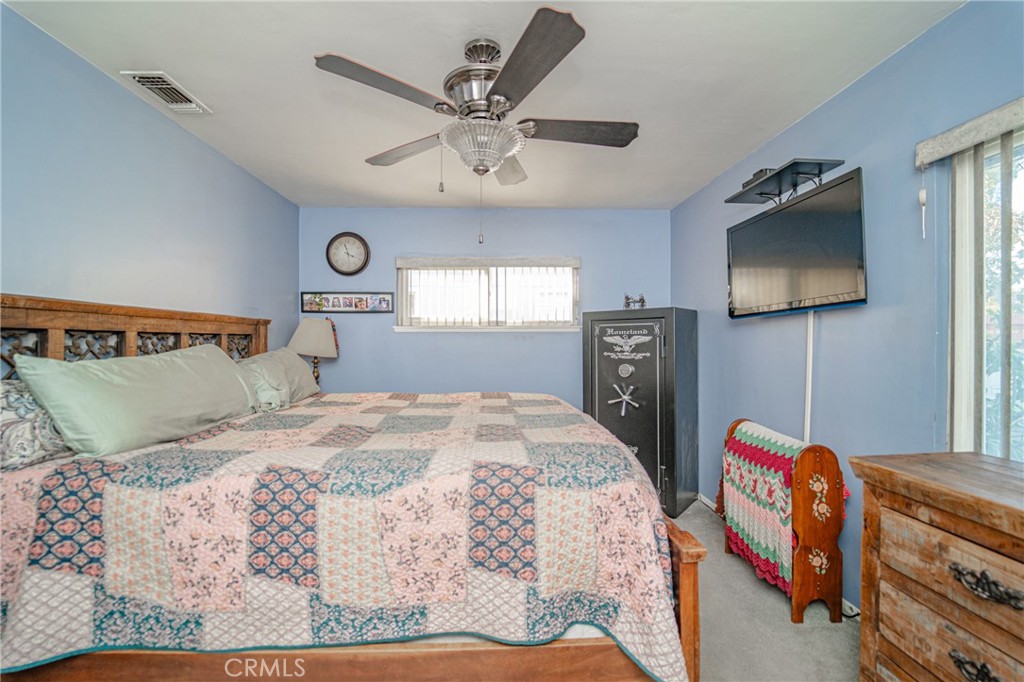 15212 Elmbrook Drive La Mirada, CA 90638 - Photo 32 of 51 a bedroom with a bed and a flat screen tv