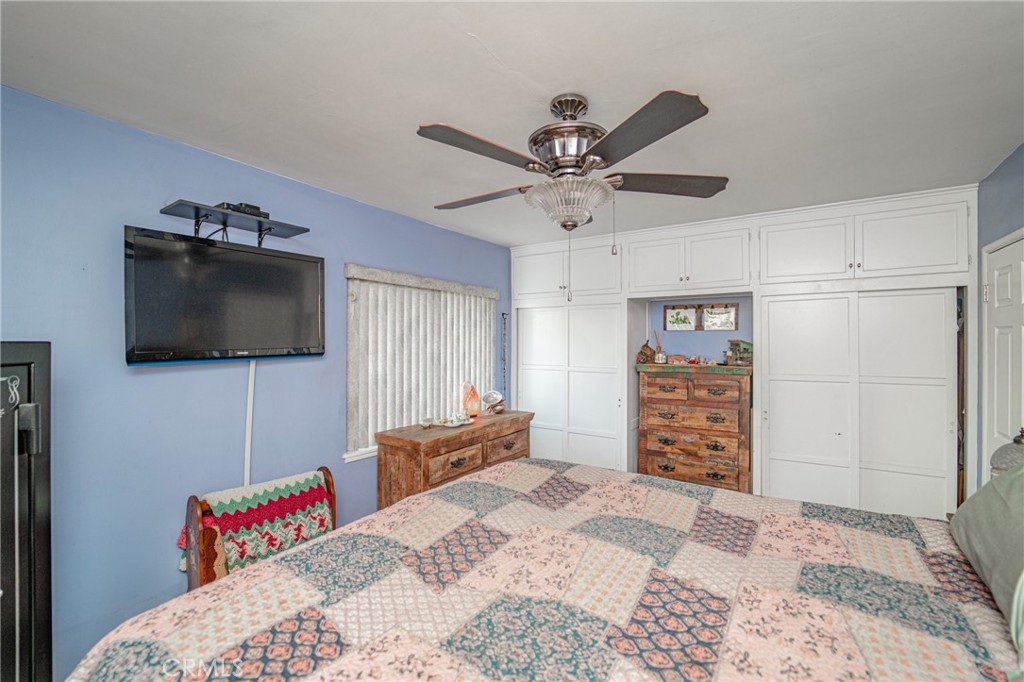 15212 Elmbrook Drive La Mirada, CA 90638 - Photo 33 of 51 a bedroom with a bed and a flat screen tv