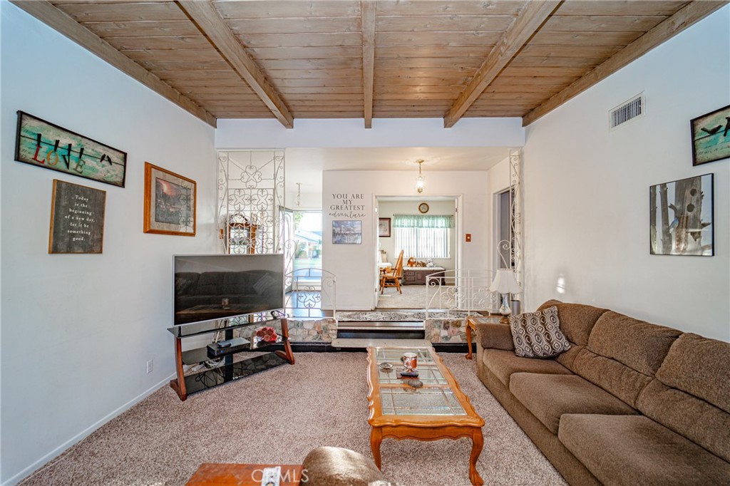 15212 Elmbrook Drive La Mirada, CA 90638 - Photo 10 of 51 a living room with furniture and a flat screen tv
