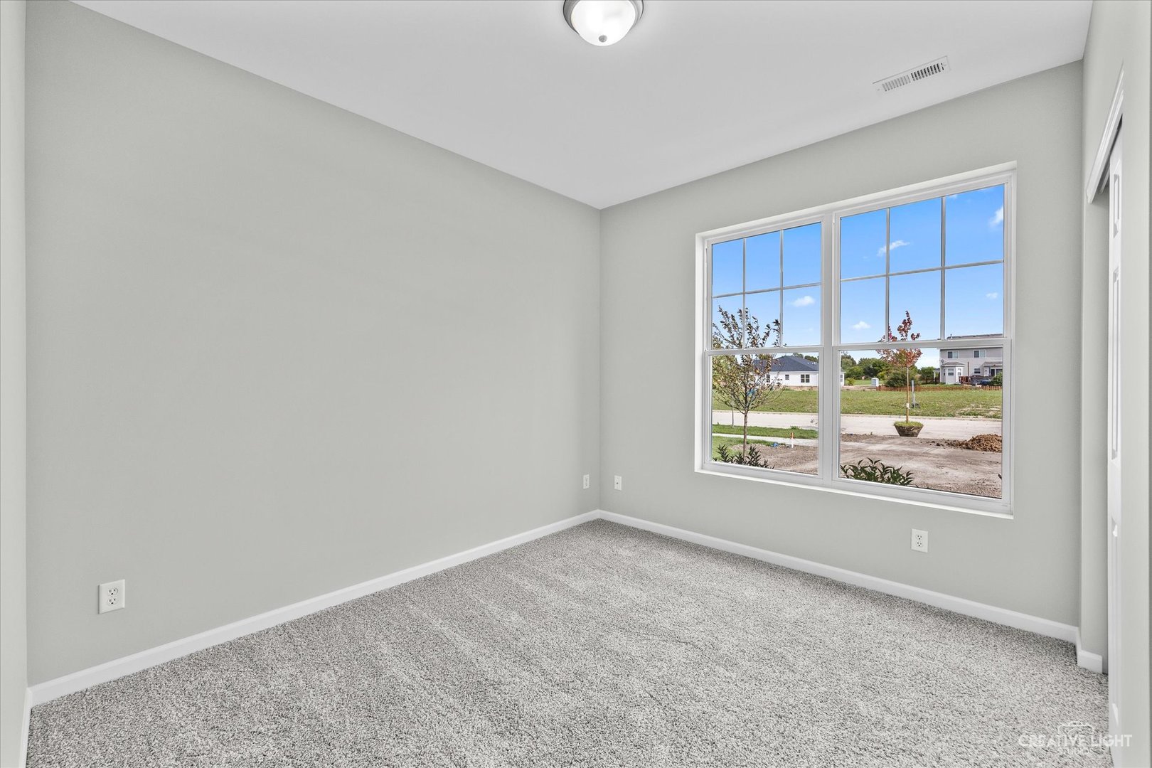 467 Preston Street Cortland, IL 60112 - Photo 4 of 17 a view of an empty room with a window