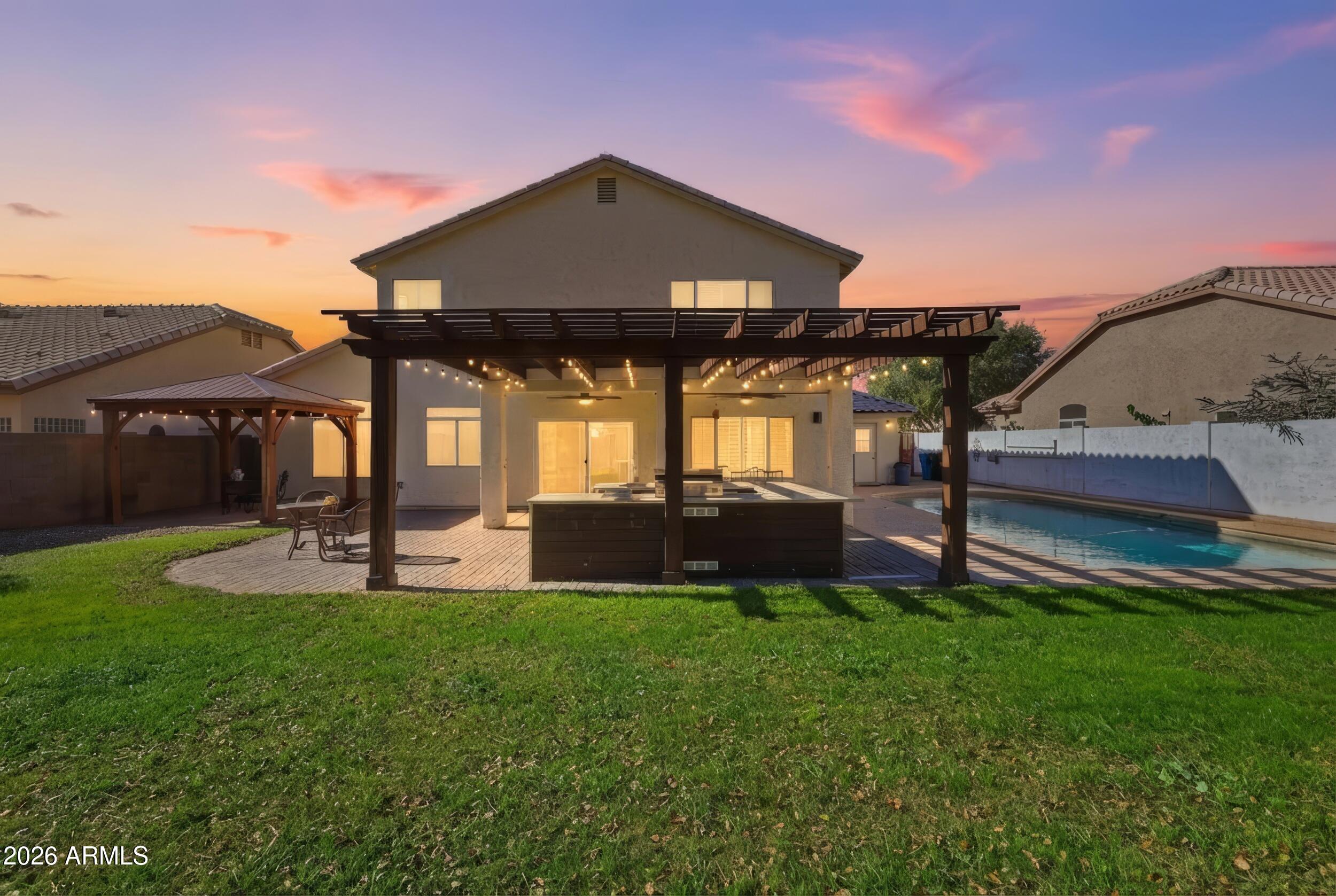 14025 South 44th Street Phoenix, AZ 85044 - Photo 1 of 52 a view of a house with a yard and sitting area