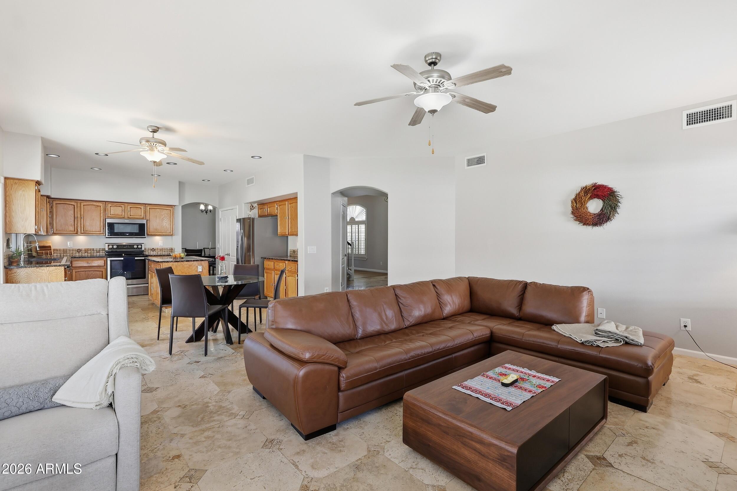 14025 South 44th Street Phoenix, AZ 85044 - Photo 15 of 52 a living room with furniture and kitchen view